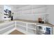 Well-organized pantry with wooden countertops, open shelving, and a convenient wine refrigerator at 701 Dartmouth Rd, Raleigh, NC 27609