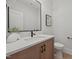 Stylish powder room with marble countertop, modern faucet, and contemporary decor at 701 Dartmouth Rd, Raleigh, NC 27609