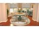 Cozy dining room features a round table, hardwood floors, and lots of natural light at 7250 Nc 751 Hwy # 2101, Durham, NC 27707
