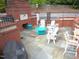 Community outdoor seating area features a brick fireplace and plenty of seating at 7250 Nc 751 Hwy # 2101, Durham, NC 27707