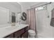 Bathroom with shower, toilet and dark brown vanity at 108 Cullen Ct, Clayton, NC 27520