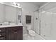 Clean bathroom with single vanity, shower, and updated fixtures at 108 Cullen Ct, Clayton, NC 27520