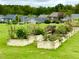 Community garden with several raised garden beds at 108 Cullen Ct, Clayton, NC 27520