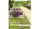 Landscaped community garden with raised beds and purple flowers at 108 Cullen Ct, Clayton, NC 27520