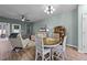 Bright dining area with table and chairs, hardwood floors, and access to living room at 108 Cullen Ct, Clayton, NC 27520