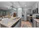 Open concept kitchen with stainless steel appliances and island at 108 Cullen Ct, Clayton, NC 27520
