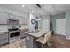 Kitchen island with granite countertop and stainless steel sink at 108 Cullen Ct, Clayton, NC 27520