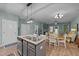 Open concept kitchen with island and view into living room at 108 Cullen Ct, Clayton, NC 27520