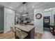 Modern kitchen with island, stainless steel appliances, and granite countertops at 108 Cullen Ct, Clayton, NC 27520
