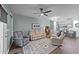 Relaxing living room with plush seating, ceiling fan, and open to kitchen and dining at 108 Cullen Ct, Clayton, NC 27520