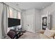 Living room with a sofa, TV, and access to another room at 108 Cullen Ct, Clayton, NC 27520
