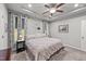 Bright main bedroom with king-size bed, ceiling fan and plenty of natural light at 108 Cullen Ct, Clayton, NC 27520
