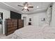 Spacious main bedroom with king-size bed, dresser and access to bathroom at 108 Cullen Ct, Clayton, NC 27520