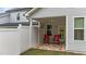 Covered patio with two red chairs and a rug at 108 Cullen Ct, Clayton, NC 27520