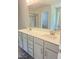 Bathroom with double vanity, a quartz countertop, and a glass-enclosed shower at 321 Hopewell Branch Ct, Smithfield, NC 27577