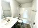 Bathroom features a vanity and a shower-tub combo at 321 Hopewell Branch Ct, Smithfield, NC 27577