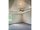Bright and airy bedroom featuring a tray ceiling and large windows at 321 Hopewell Branch Ct, Smithfield, NC 27577