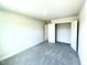 Spacious bedroom with plush carpeting and walk-in closet access at 321 Hopewell Branch Ct, Smithfield, NC 27577