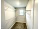 Walk-in closet with wire shelving and a small window at 321 Hopewell Branch Ct, Smithfield, NC 27577