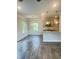 Open kitchen and dining area with granite countertops and stainless steel appliances at 321 Hopewell Branch Ct, Smithfield, NC 27577
