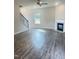 Spacious living room featuring hardwood floors, a fireplace, and a staircase at 321 Hopewell Branch Ct, Smithfield, NC 27577
