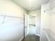 Bright walk-in closet features wire shelving and access to the bedroom at 321 Hopewell Branch Ct, Smithfield, NC 27577