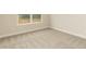 Bedroom with neutral carpet and light walls; large window provides ample natural light at 347 Hopewell Branch Ct, Smithfield, NC 27577