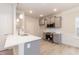 Modern kitchen with gray cabinets, quartz countertops, and stainless steel appliances at 347 Hopewell Branch Ct, Smithfield, NC 27577
