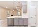 Bright kitchen island with stainless steel dishwasher, sink, and pendant lighting overlooking a living area with a fireplace at 347 Hopewell Branch Ct, Smithfield, NC 27577