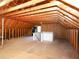 Spacious unfinished attic with wood framing, and a staircase at 102 Preston Pines Dr, Cary, NC 27513