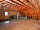 Unfinished attic space with exposed wooden beams and HVAC systems at 102 Preston Pines Dr, Cary, NC 27513