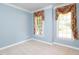 Light blue bedroom with carpet, natural light from the windows and decorative floral curtain swags at 102 Preston Pines Dr, Cary, NC 27513