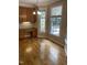 Bright breakfast nook with ample natural light streaming through large windows and stylish wooden cabinets at 102 Preston Pines Dr, Cary, NC 27513
