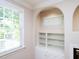 Built in shelving next to the window at 102 Preston Pines Dr, Cary, NC 27513