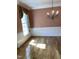 Dining room with wooden floors, neutral walls, natural light and a chandelier at 102 Preston Pines Dr, Cary, NC 27513