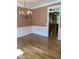 Dining area with wooden floors, a chandelier, and neutral walls for elegant dining at 102 Preston Pines Dr, Cary, NC 27513