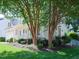 Two-story house exterior with landscaping and trees in the front yard at 102 Preston Pines Dr, Cary, NC 27513