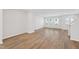 Bright living room features lots of natural light and wood-look floors at 1206 Holding Village Way, Wake Forest, NC 27587
