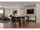 Open-concept living room and dining area with modern furniture and stylish decor with hardwood floors at 1206 Holding Village Way, Wake Forest, NC 27587