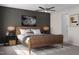 Comfortable primary bedroom with a ceiling fan, natural light, and stylish decor at 1206 Holding Village Way, Wake Forest, NC 27587