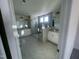 Large bathroom with double vanity, a walk-in shower, and grey tile floors at 1528 Maelyn Way, Fuquay Varina, NC 27526