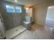Bathroom featuring glass shower with seating and tiled floors at 1528 Maelyn Way, Fuquay Varina, NC 27526