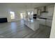Modern kitchen featuring white cabinets, granite island, and stainless steel appliances at 1528 Maelyn Way, Fuquay Varina, NC 27526