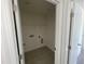 Convenient laundry room with built-in shelving at 1528 Maelyn Way, Fuquay Varina, NC 27526