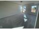 Spacious main bedroom with carpeted floors and large windows providing abundant natural light at 1528 Maelyn Way, Fuquay Varina, NC 27526