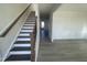 Bright entryway with an elegant staircase and view of the living area at 1528 Maelyn Way, Fuquay Varina, NC 27526
