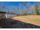 View of backyard and detached garage, as seen from the covered back porch at 240 Sequoia Dr, Louisburg, NC 27549
