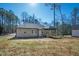Rear exterior view of the home featuring a well maintained yard and spacious porch at 240 Sequoia Dr, Louisburg, NC 27549