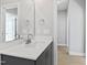 Bathroom vanity featuring a gray cabinet, white countertop, and chrome faucet at 240 Sequoia Dr, Louisburg, NC 27549