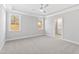 Spacious primary bedroom features large windows and an en suite bathroom with modern finishes at 240 Sequoia Dr, Louisburg, NC 27549